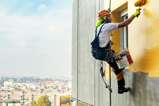 Rope-access painter on an office tower in Newport Center